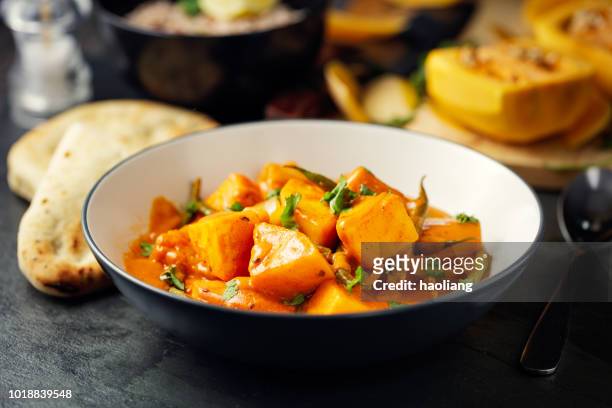 healthy butternut squash and beans curry - curry stock pictures, royalty-free photos & images