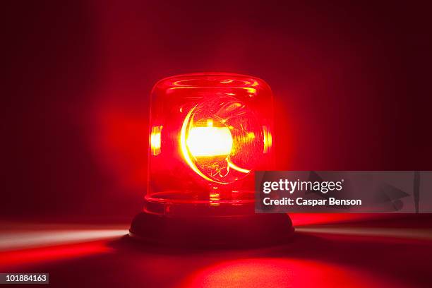 a red emergency light - gevaar stockfoto's en -beelden