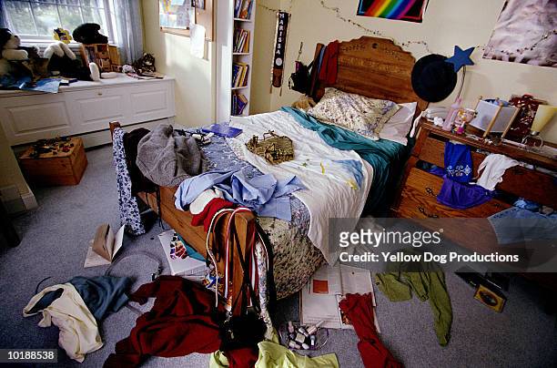 teenager's bedroom with clothes, books and cds thrown around - empty bedroom stock pictures, royalty-free photos & images