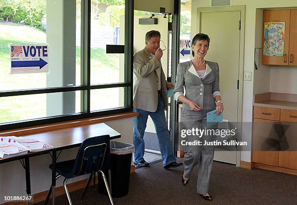 Republican candidate for U.S. Senate and former HP CEO Carly Fiorina and her husband Frank Fiorina arrive at a polling place to vote June 8, 2010 in...