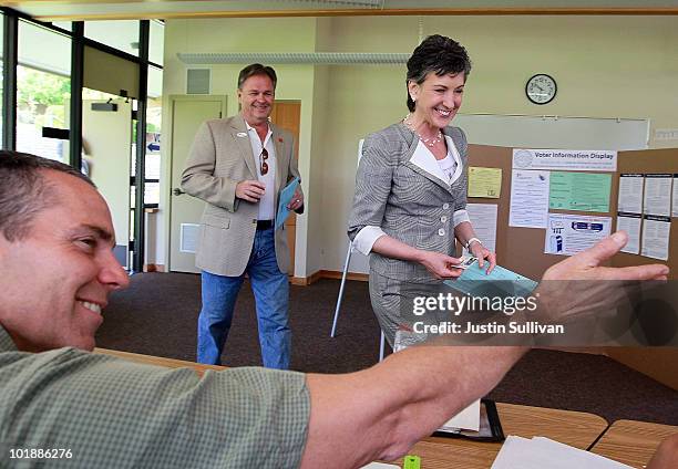 Republican candidate for U.S. Senate and former HP CEO Carly Fiorina and her husband Frank Fiorina arrive at a polling place to vote June 8, 2010 in...