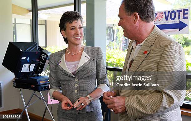 Republican candidate for U.S. Senate and former HP CEO Carly Fiorina smiles with her husband Frank Fiorina after casting their ballots at a polling...