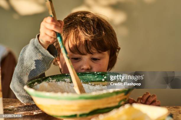 child playing at home - cooking mess stock-fotos und bilder