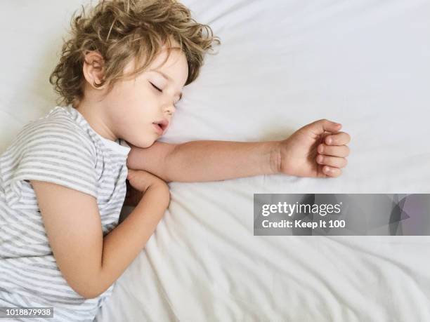 young child sleeping - boy asleep in bed stock pictures, royalty-free photos & images