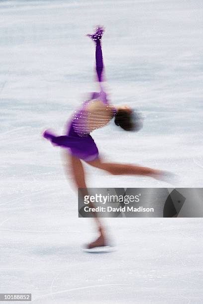 female figure skater spinning on ice (digital enhancement) - grand prix of figure skating skate canada international stockfoto's en -beelden