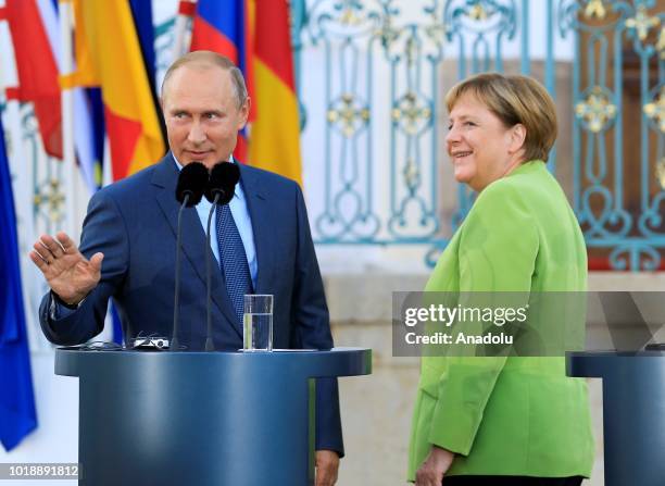 German Chancellor Angela Merkel and Russian President Vladimir Putin hold a press conference ahead of their meeting at Meseberg Palace in Gransee...