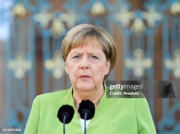 German Chancellor Angela Merkel and Russian President Vladimir Putin hold a press conference ahead of their meeting at Meseberg Palace in Gransee...