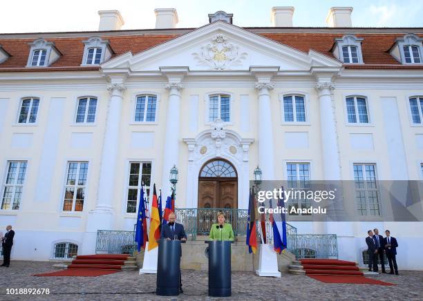 German Chancellor Angela Merkel and Russian President Vladimir Putin hold a press conference ahead of their meeting at Meseberg Palace in Gransee...