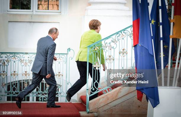 German Chancellor and leader of the German Christian Democrats Angela Merkel welcomes the Russian President, Vladimir Putin, at Schloss Meseberg...