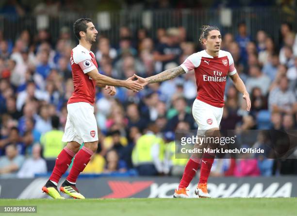 Henrikh Mkhitaryan of Arsenal is congratulated by Hector Bellerin of Arsenal after scoring the first goal for his team during the Premier League...