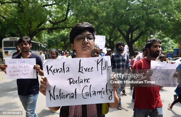 Students of Jawaharlal Nehru University protest against the government for not helping the people in Kerala affected from floods at Parliament...