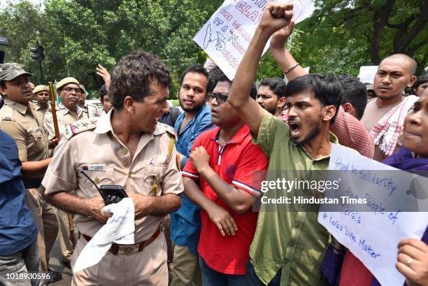 Students of Jawaharlal Nehru University protest against the government for not helping the people in Kerala affected from floods at Parliament...