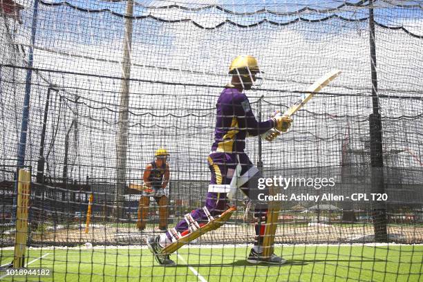 In this handout image provided by CPL T20, Denesh Ramdin and Chris Lynn bat during a Trinbago Knight Riders nets and training session at Central...