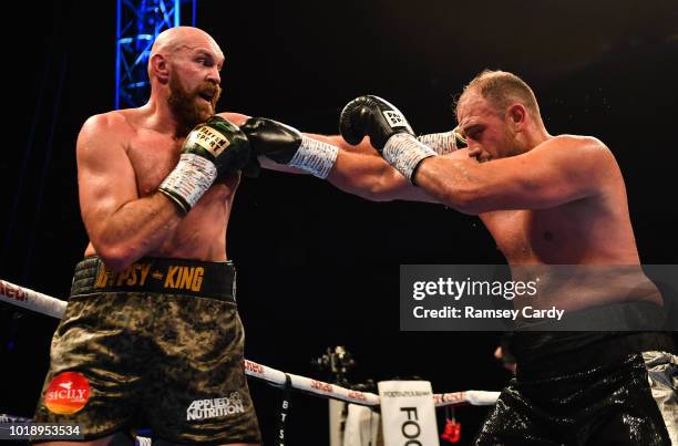 Belfast , United Kingdom - 18 August 2018; Tyson Fury, left, in action against Francesco Pianeta during their heavyweight bout at Windsor Park in...