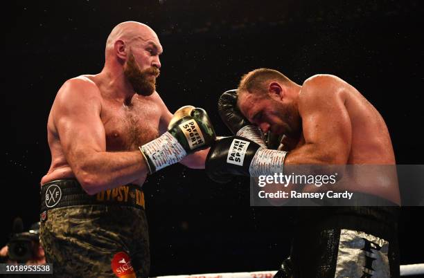 Belfast , United Kingdom - 18 August 2018; Tyson Fury, left, in action against Francesco Pianeta during their heavyweight bout at Windsor Park in...