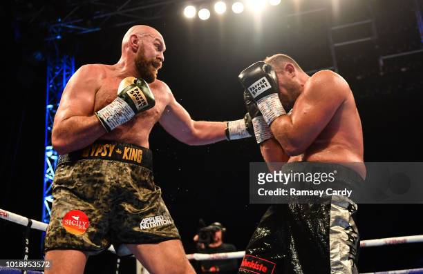Belfast , United Kingdom - 18 August 2018; Tyson Fury, left, in action against Francesco Pianeta during their heavyweight bout at Windsor Park in...
