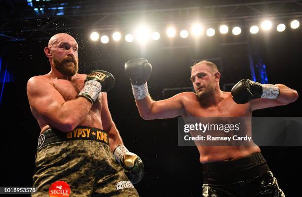 Belfast , United Kingdom - 18 August 2018; Tyson Fury, left, in action against Francesco Pianeta during their heavyweight bout at Windsor Park in...