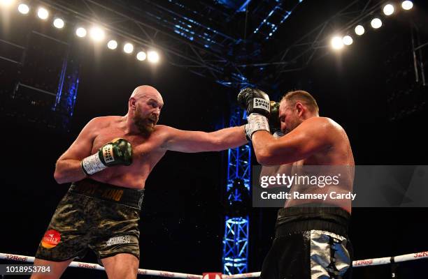 Belfast , United Kingdom - 18 August 2018; Tyson Fury, left, in action against Francesco Pianeta during their heavyweight bout at Windsor Park in...