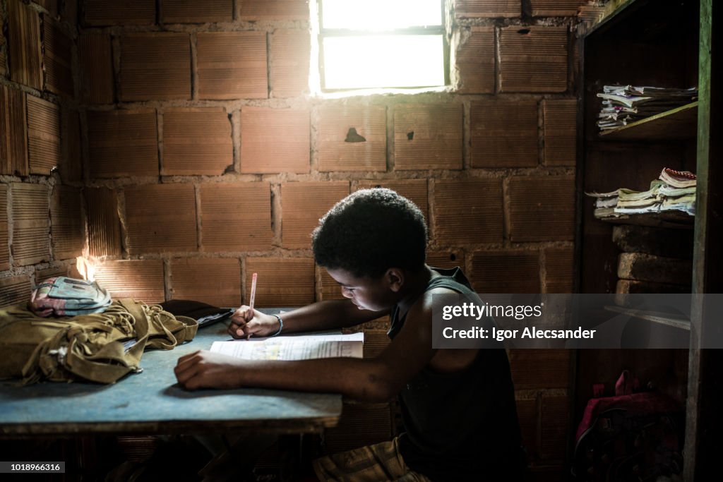 Brazilian boy studying at home