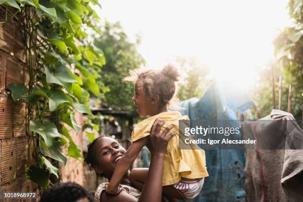 brazilian children playing in the community - slum stock pictures, royalty-free photos & images