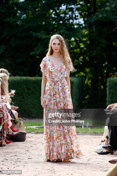 Model walks the runway at the byTiMo show during Oslo Runway SS19 at Oslo Ladegard on August 14, 2018 in Oslo, Norway.