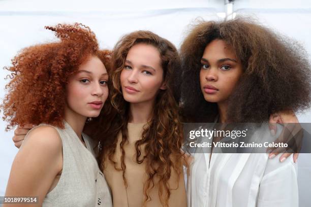 Models are seen backstage ahead of the Iben show during Oslo Runway SS19 at Prindsen Hage on August 14, 2018 in Oslo, Norway.