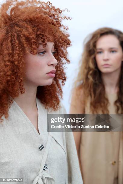 Models are seen backstage ahead of the Iben show during Oslo Runway SS19 at Prindsen Hage on August 14, 2018 in Oslo, Norway.