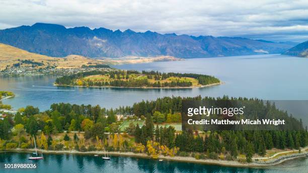 a view over lake wakatipu and queenstown. - horizontal stock pictures, royalty-free photos & images