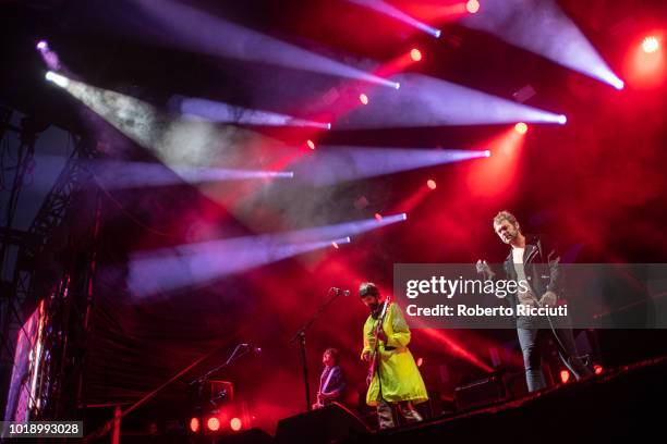 Touring guitarist Tim Carter, Sergio Pizzorno and Tom Meighan of Kasabian perform on stage at Princes Street Gardens during Edinburgh Summer Sessions...