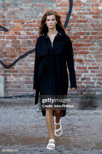 Model walks the runway at the Iben show during Oslo Runway SS19 at Prindsen Hage on August 14, 2018 in Oslo, Norway.