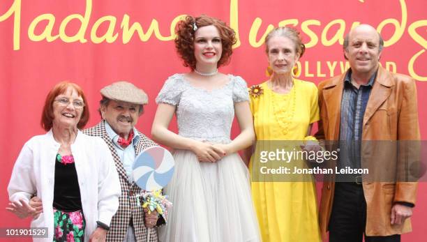 Elizabeth Barrington, Jerry Maren, Margaret O'Brien, and Joey Luft pose with a wax figure of movie icon Judy Garland at Madame Tussauds on June 8,...