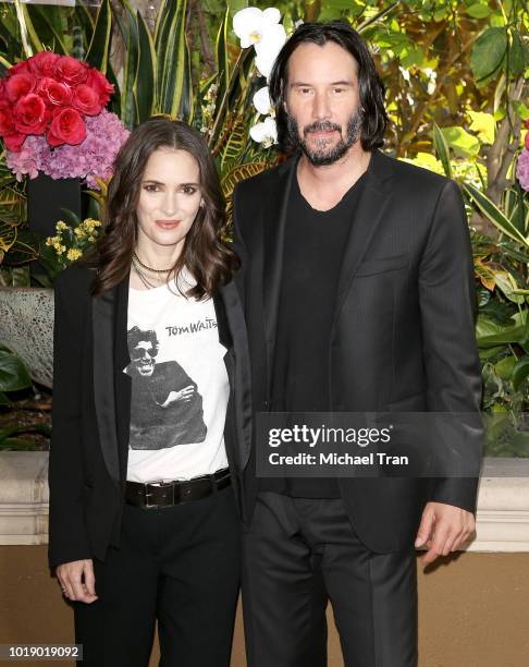 Winona Ryder and Keanu Reeves attend the photo call for Regatta's "Destination Wedding" held at Four Seasons Hotel Los Angeles at Beverly Hills on...