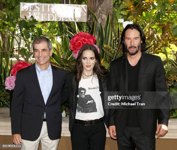 Victor Levin, Winona Ryder and Keanu Reeves attend the photo call for Regatta's "Destination Wedding" held at Four Seasons Hotel Los Angeles at...