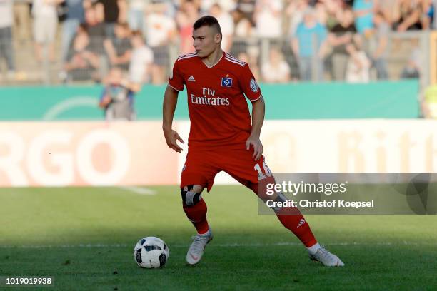 Vasilije Janjicic of Hamburg runs with the ball during the DFB Cup first round match between TuS Erndtebrueck and Hamburger SV at Leimbachstadion on...