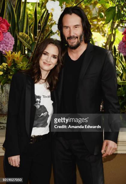 Actress Winona Ryder and actor Keanu Reeves attend a photo call for Regatta's "Destination Wedding" at the Four Seasons Hotel Los Angeles at Beverly...