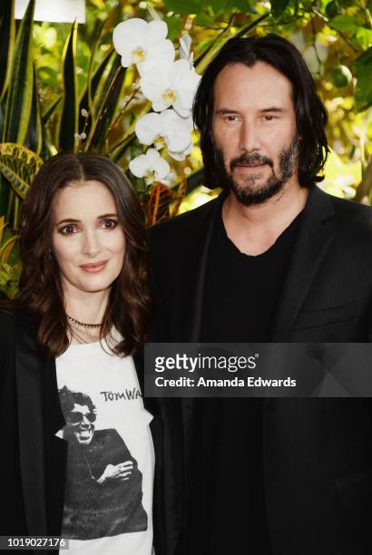 Actress Winona Ryder and actor Keanu Reeves attend a photo call for Regatta's "Destination Wedding" at the Four Seasons Hotel Los Angeles at Beverly...