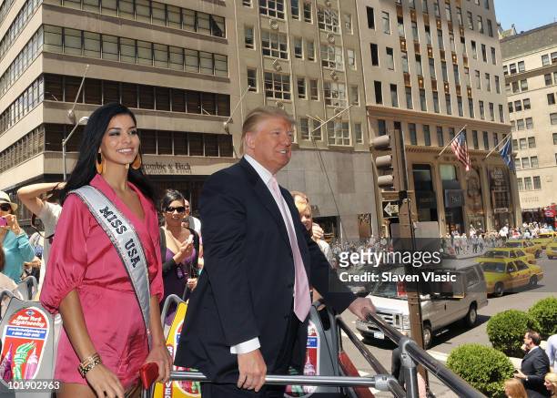 Miss USA Rima Fakih and estate mogul Donald Trump attend Donald Trump's Gray Line New York's Ride of Fame campaign dedication at front of Trump Tower...