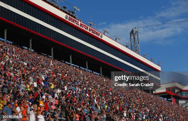 Fans cheer during the Monster Energy NASCAR Cup Series Bass Pro Shops NRA Night Race at Bristol Motor Speedway on August 18, 2018 in Bristol,...