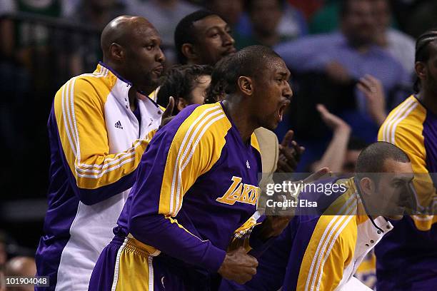 Lamar Odom, Ron Artest and Jordan Farmar of the Los Angeles Lakers support their teammates from the bench against the Boston Celtics in Game Three of...