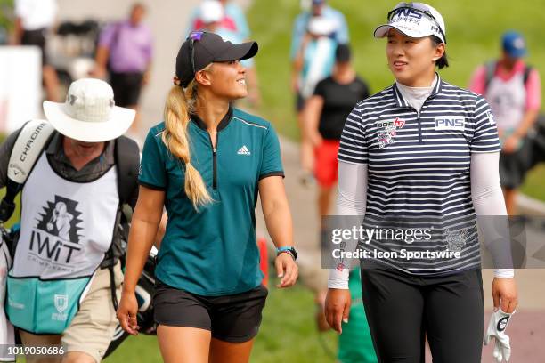 Golfer Danielle Kang and LPGA golfer golfer Amy Yang walk to the ninth tee during the third round of the Indy Women In Tech on August 18, 2018 at the...