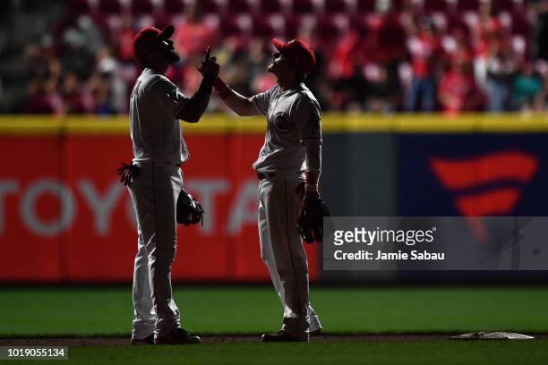Jose Peraza of the Cincinnati Reds, left, and Scooter Gennett of the Cincinnati Reds celebrate after the Reds defeated the San Francisco Giants 7-1...