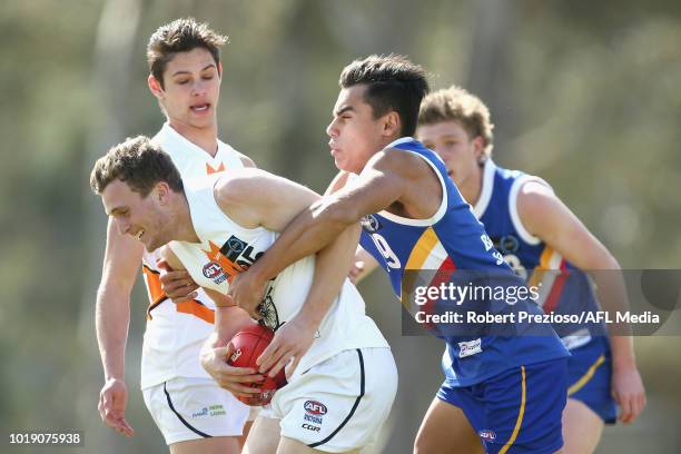 Jacob Martin of Calder Cannons is tackled during the TAC Cup round 15 match between Eastern Ranges and Calder Cannons at Avalon Airport Oval on...