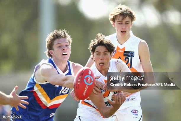 Benjamin Reddick of Calder Cannons handballs during the TAC Cup round 15 match between Eastern Ranges and Calder Cannons at Avalon Airport Oval on...