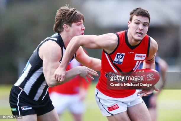 Gus Borthwick of the Magpies tackles Blake Mullane of Frankston during the round 20 VFL match between Collingwood and Frankston at Victoria Park on...
