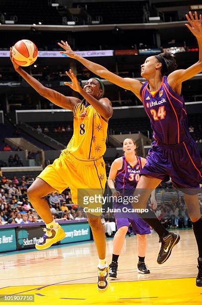 DeLisha Milton-Jones of the Los Angeles Sparks goes to the basket against DeWanna Bonner#24 of the Phoenix Mercury on June 8, 2010 at Staples Center...
