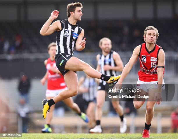 Josh Daicos of the Magpies kicks the ball during the round 20 VFL match between Collingwood and Frankston at Victoria Park on August 19, 2018 in...