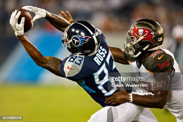 Devin Ross of the Tennessee Titans catches a pass while being defended by Isaiah Johnson of the Tampa Bay Buccaneers at Nissan Stadium during week 2...
