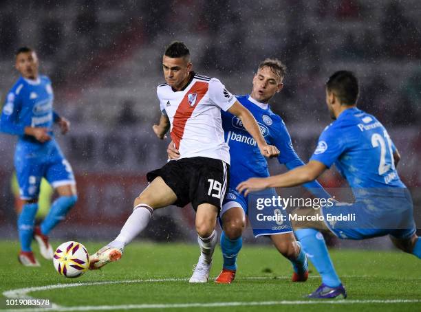 Rafael Santos Borre of River Plate fights for the ball with Gaston Gil Romero of Belgrano during a match between River Plate and Belgrano as part of...