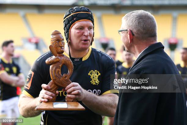 Thomas Waldrom of Wellington receives the Mike Gibson Memorial Trophy after winning the round one Mitre 10 Cup match between Wellington and Otago at...