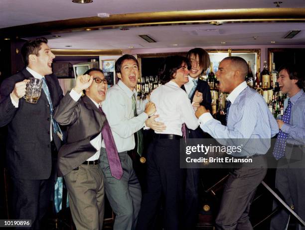 businessmen at bar cheering - man party night bar posing stock pictures, royalty-free photos & images